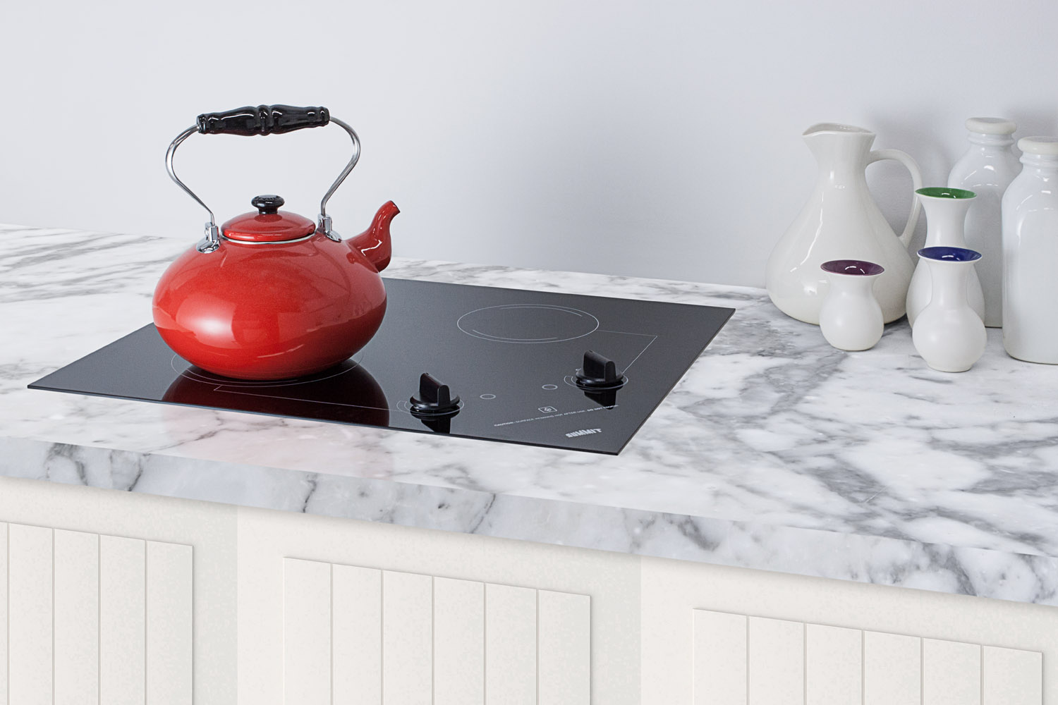 2-burner 120V electric cooktop designed for portrait or landscape installation, with smooth black ceramic glass surface
